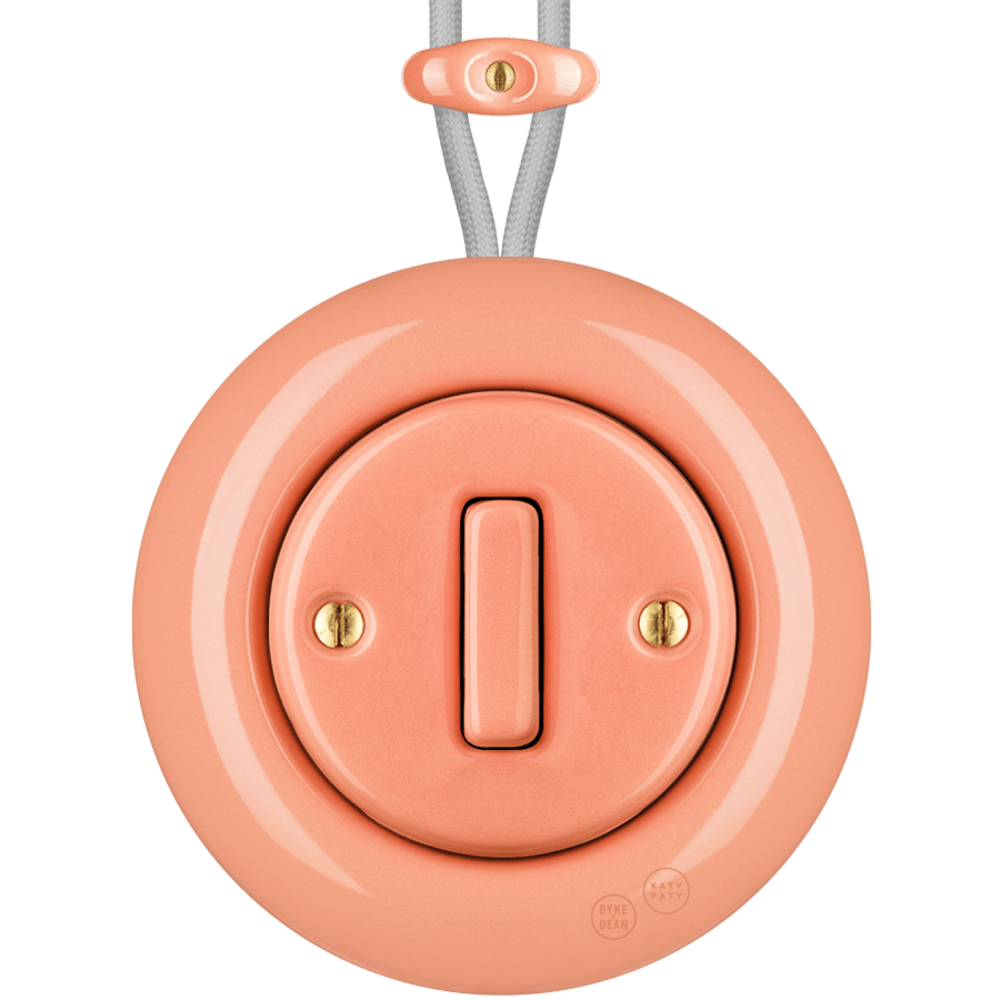 PORCELAIN KATY PATY COLONA ROUND SURFACE MOUNTED SLIM BUTTON SWITCH SALMON PINK - DYKE & DEAN