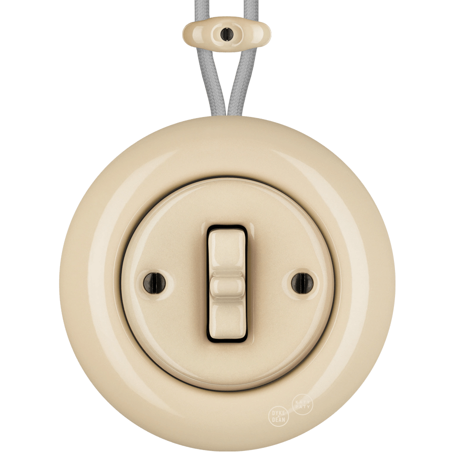 PORCELAIN KATY PATY COLONA ROUND SURFACE MOUNTED TOGGLE BUTTON SWITCH SAND - DYKE & DEAN