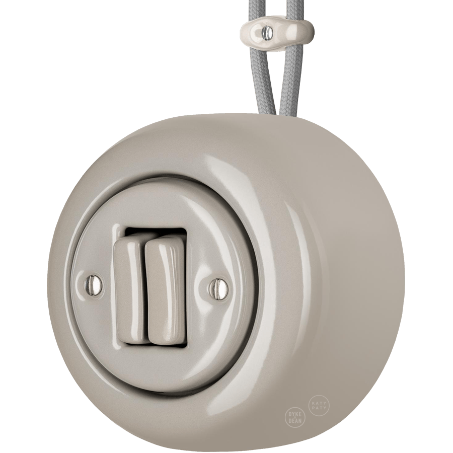 PORCELAIN ROUND SURFACE MOUNTED DOUBLE SLIM BUTTON SWITCH CAPPUCCINO - DYKE & DEAN