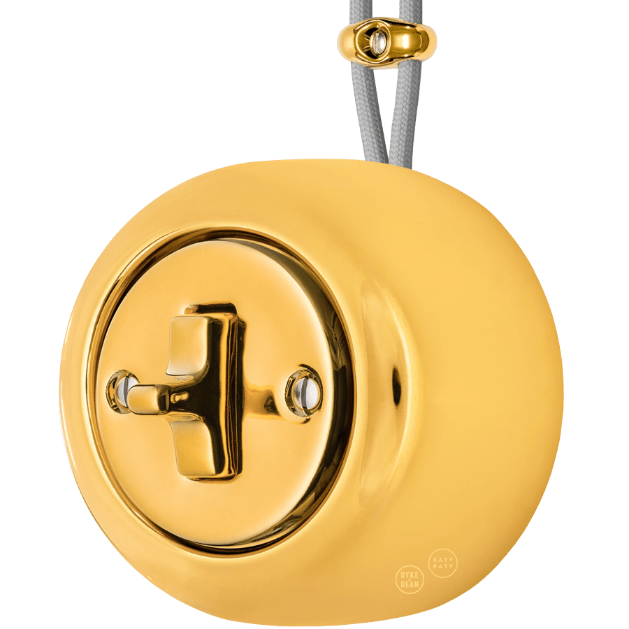 PORCELAIN ROUND SURFACE MOUNTED TOGGLE BUTTON SWITCH GOLD - DYKE & DEAN