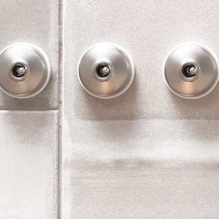 BRUSHED BRONZE INTERMEDIATE WALL SWITCHES - DYKE & DEAN